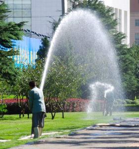 Ellicott City Sprinkler Repair techs use temporary heads to water a lawn